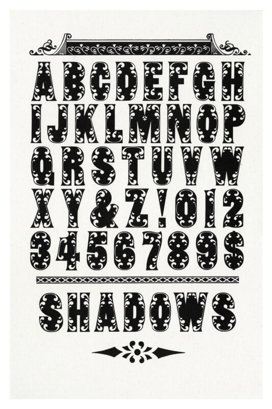 letterpress print specimen of wood type from the Rob Roy Kelly American Wood Type Collection Folio Revisited, intricate floral black letters and decorative borders, and the word shadows