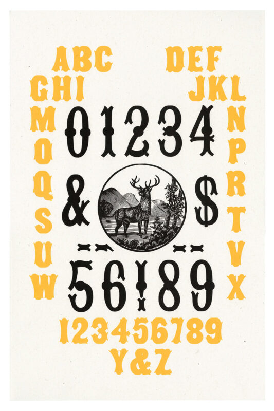 letterpress print specimen of wood type from the Rob Roy Kelly American Wood Type Collection Folio Revisited, yellow and black letters and numbers with a stag image in a circle at the center of composition