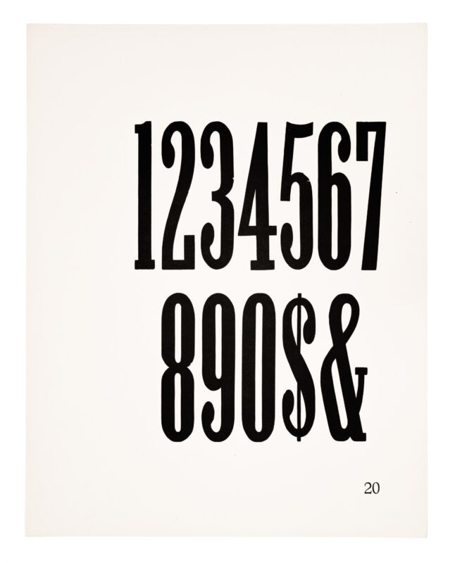 0-9 & $ of the pervious typeface, printed in black in on white paper