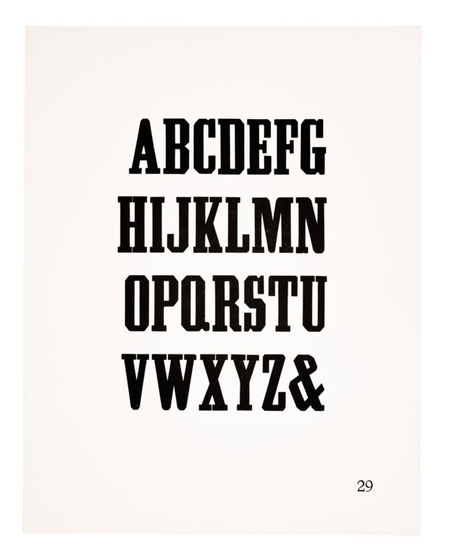 An antique-style typeface printed in black on white paper.