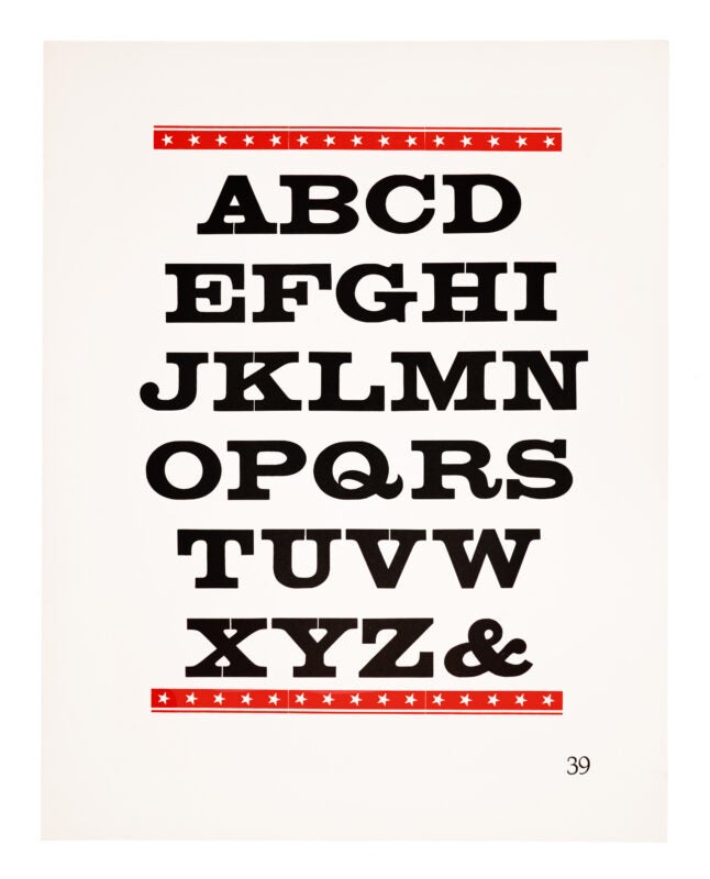 An ornament border of stars sits on the top and bottom of the page, printed in red on white paper. In the middle, an antique typeface is printed in black on white paper.