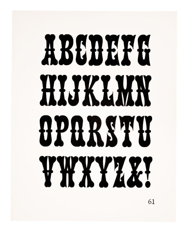 A gothic typeface printed in black on white paper.