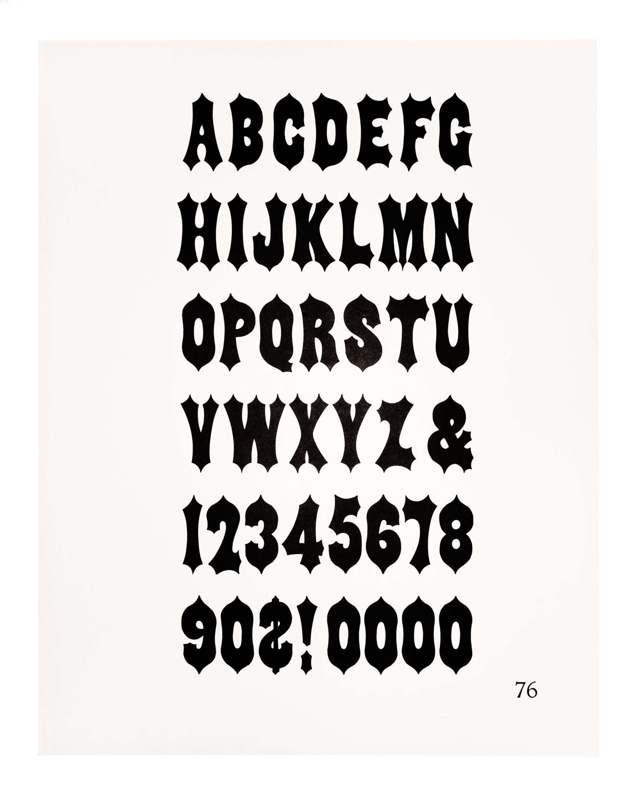 A gothic typeface printed in black on white paper.